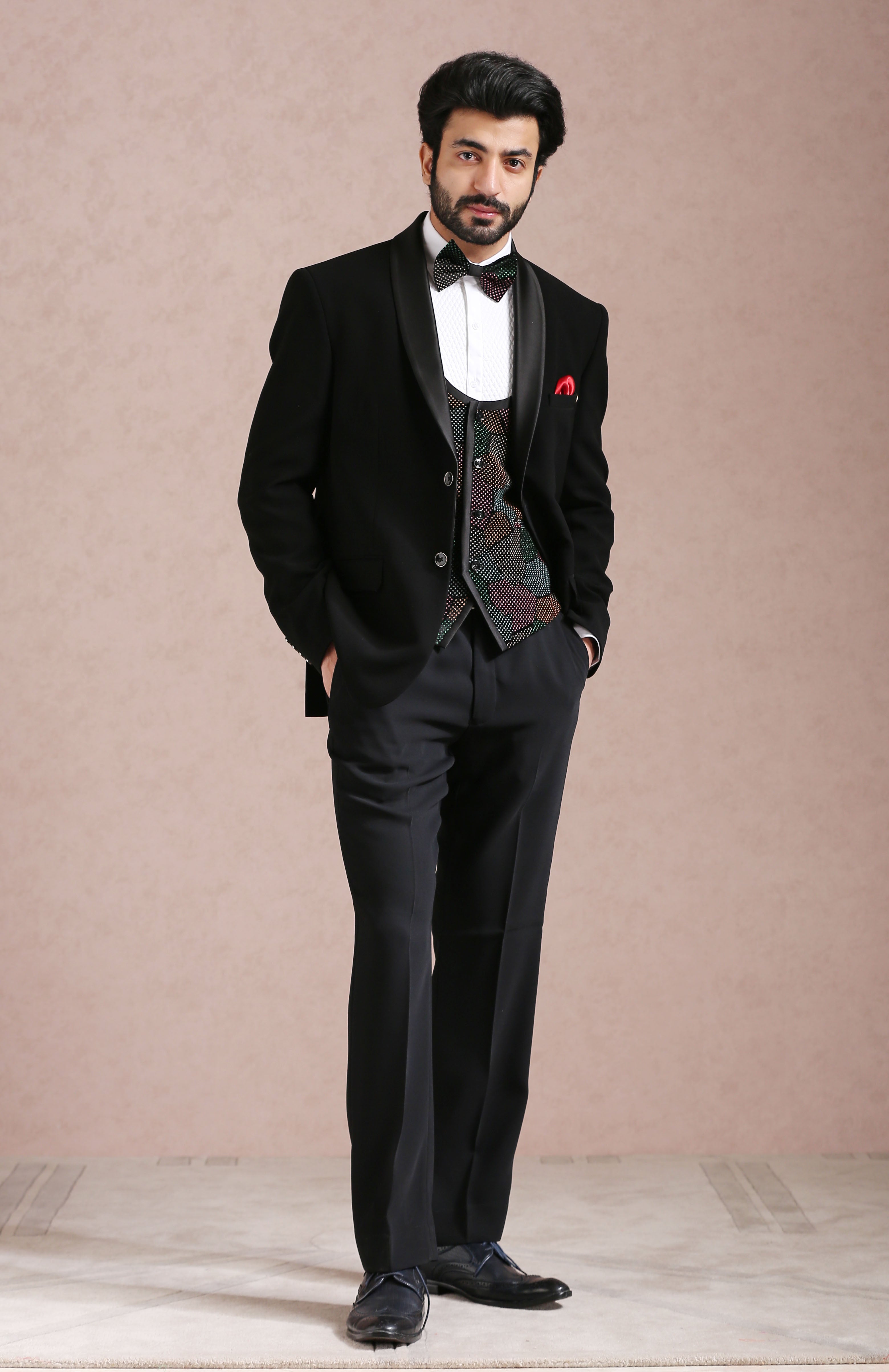 A versatile black tuxedo suit, suitable for various formal occasions.
