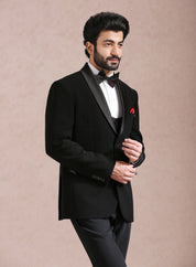 A sophisticated black tuxedo suit, ideal for black-tie events.
