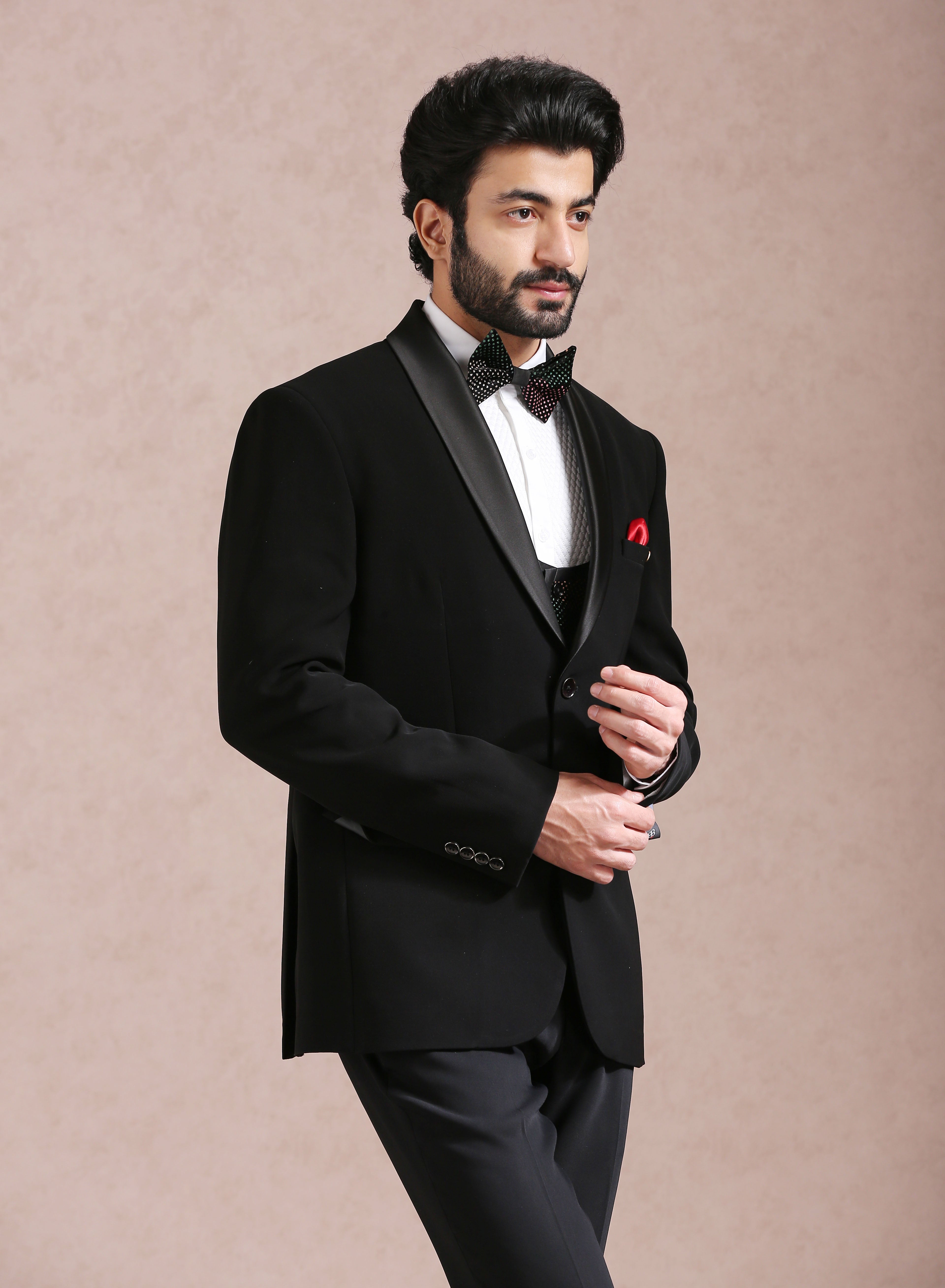 A sophisticated black tuxedo suit, ideal for black-tie events.
