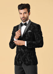 A versatile black velvet suit, suitable for various formal occasions.
