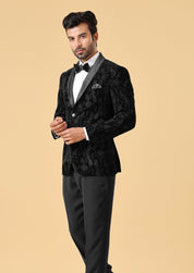 A sophisticated black velvet suit, ideal for black-tie events.
