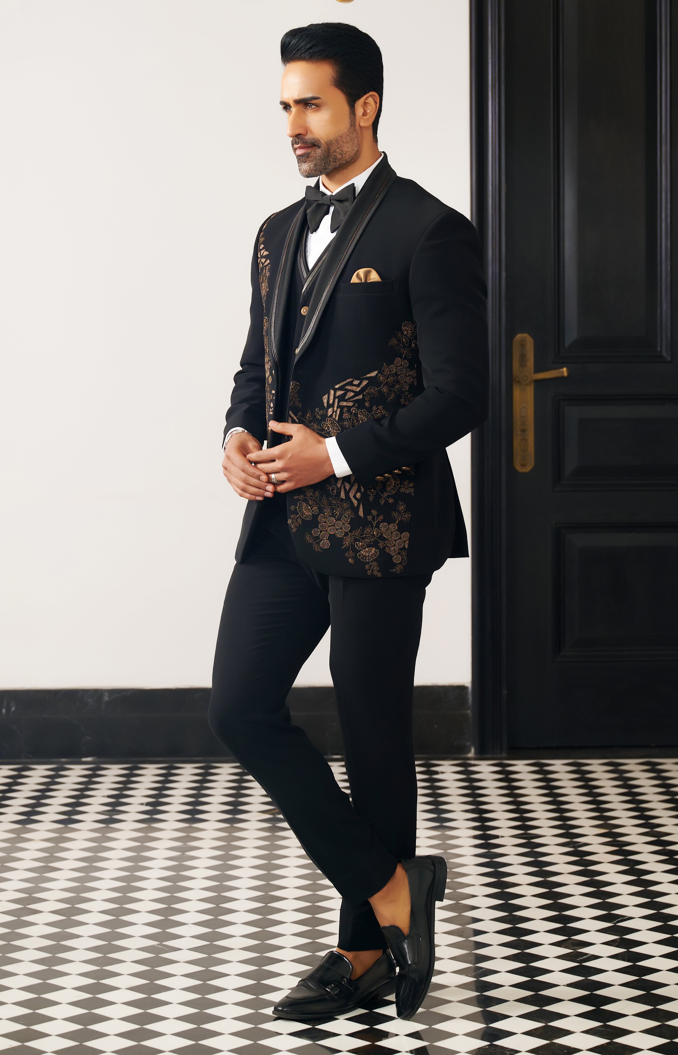 A luxurious black party wear suit, perfect for special occasions.
