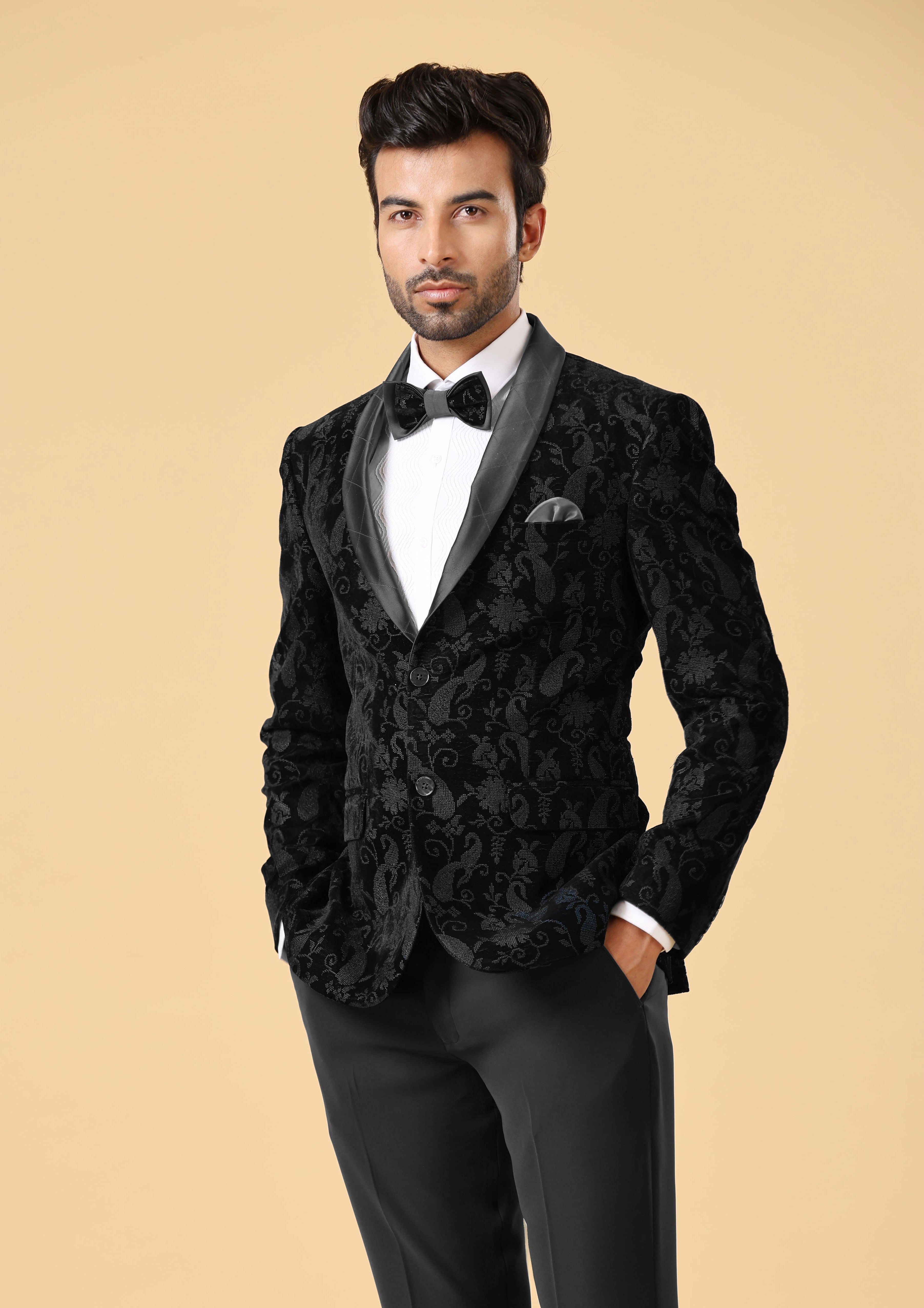 A stylish black velvet suit, the epitome of elegance.
