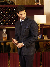 A luxurious navy blue tuxedo suit, perfect for special occasions.
A timeless navy blue tuxedo suit. 