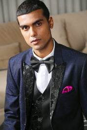 A navy blue jacquard designer suit with embroidery, designer wear.
