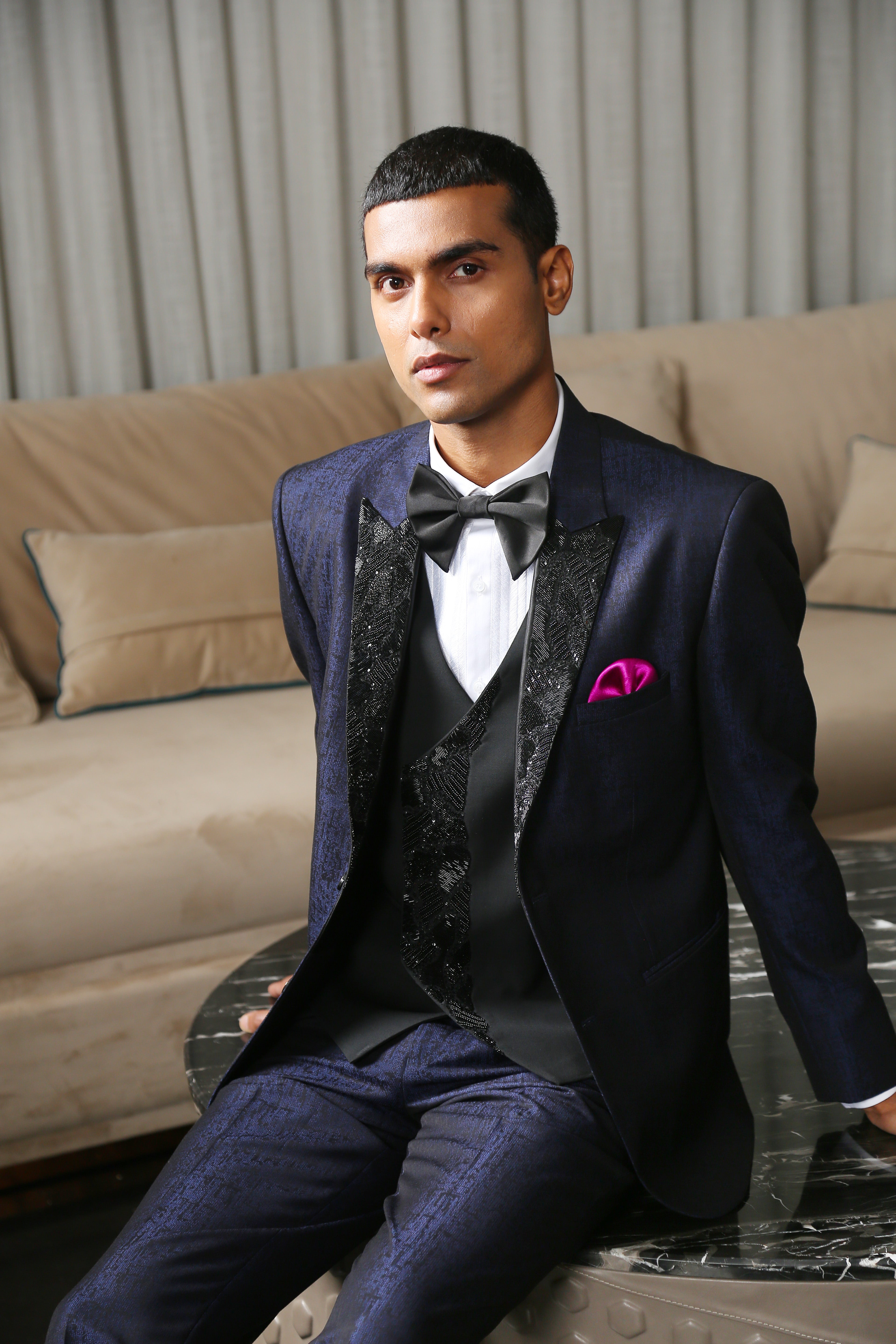  A versatile navy blue jacquard designer suit with embroidery, suitable for various occasions.
