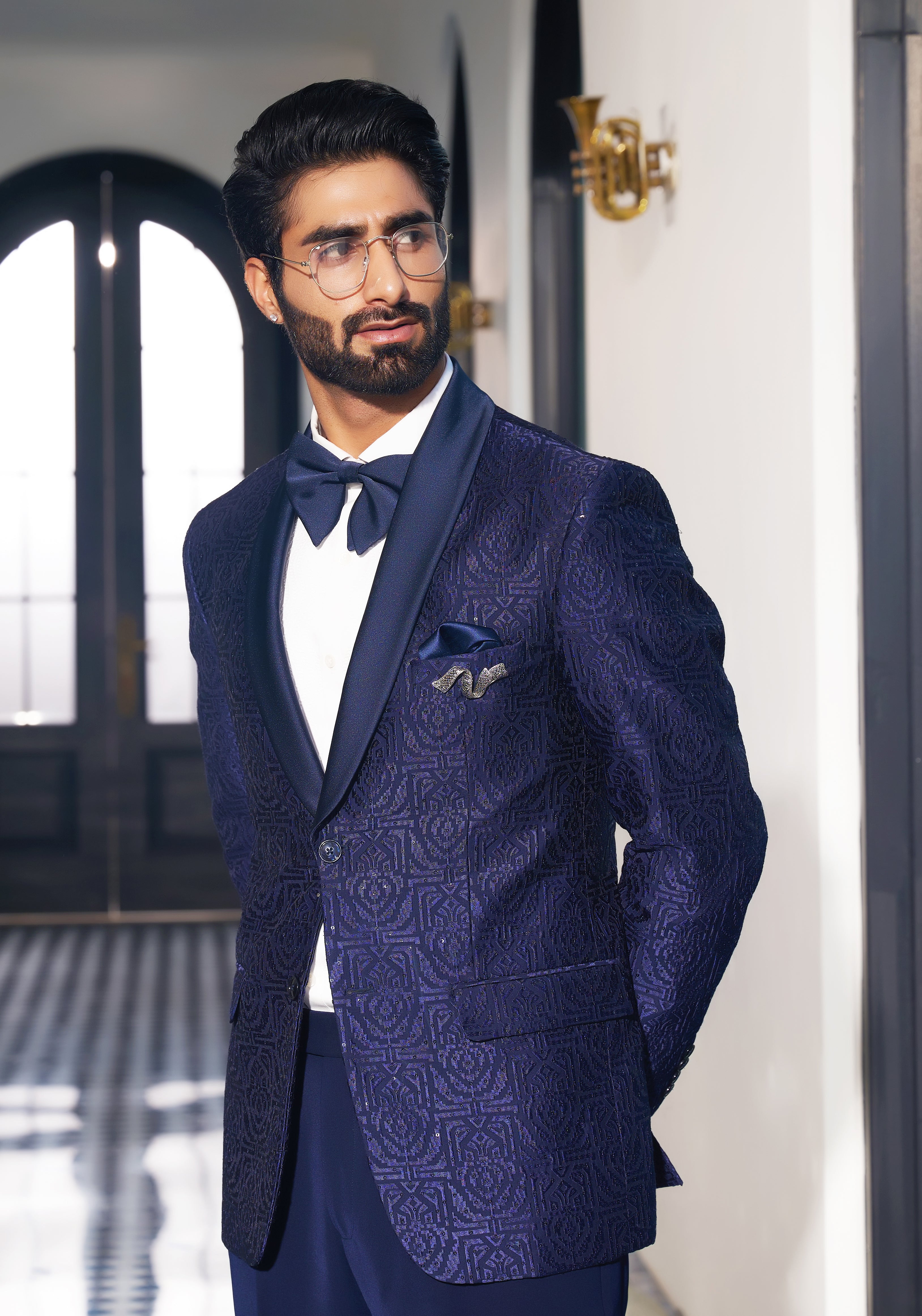 An elegant navy blue fully embroidered suit, modern men's fashion.
