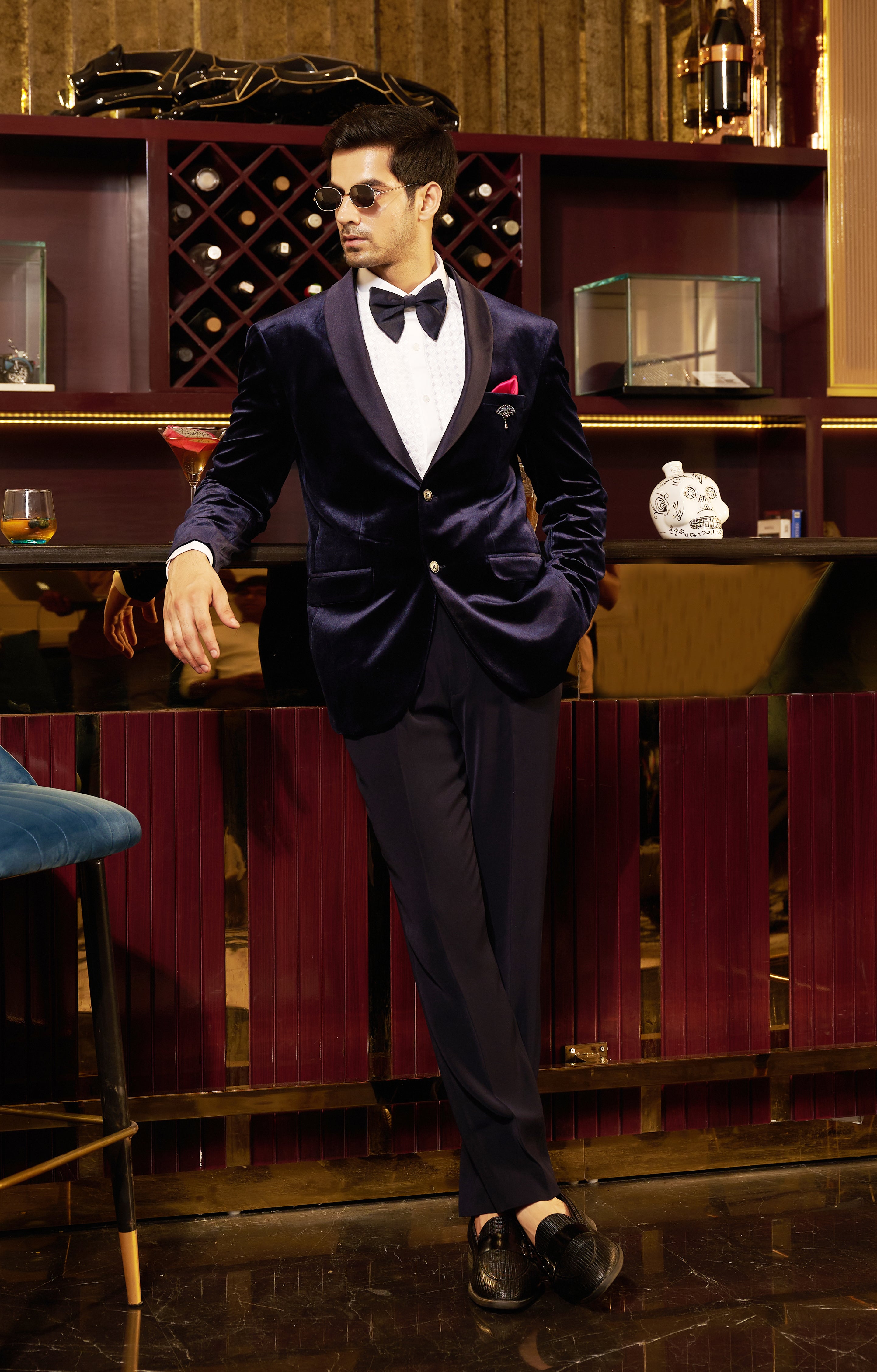 A versatile navy blue velvet suit, suitable for various formal occasions.
