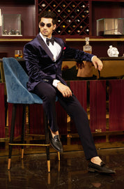 A sophisticated navy blue velvet suit, ideal for black-tie events.
