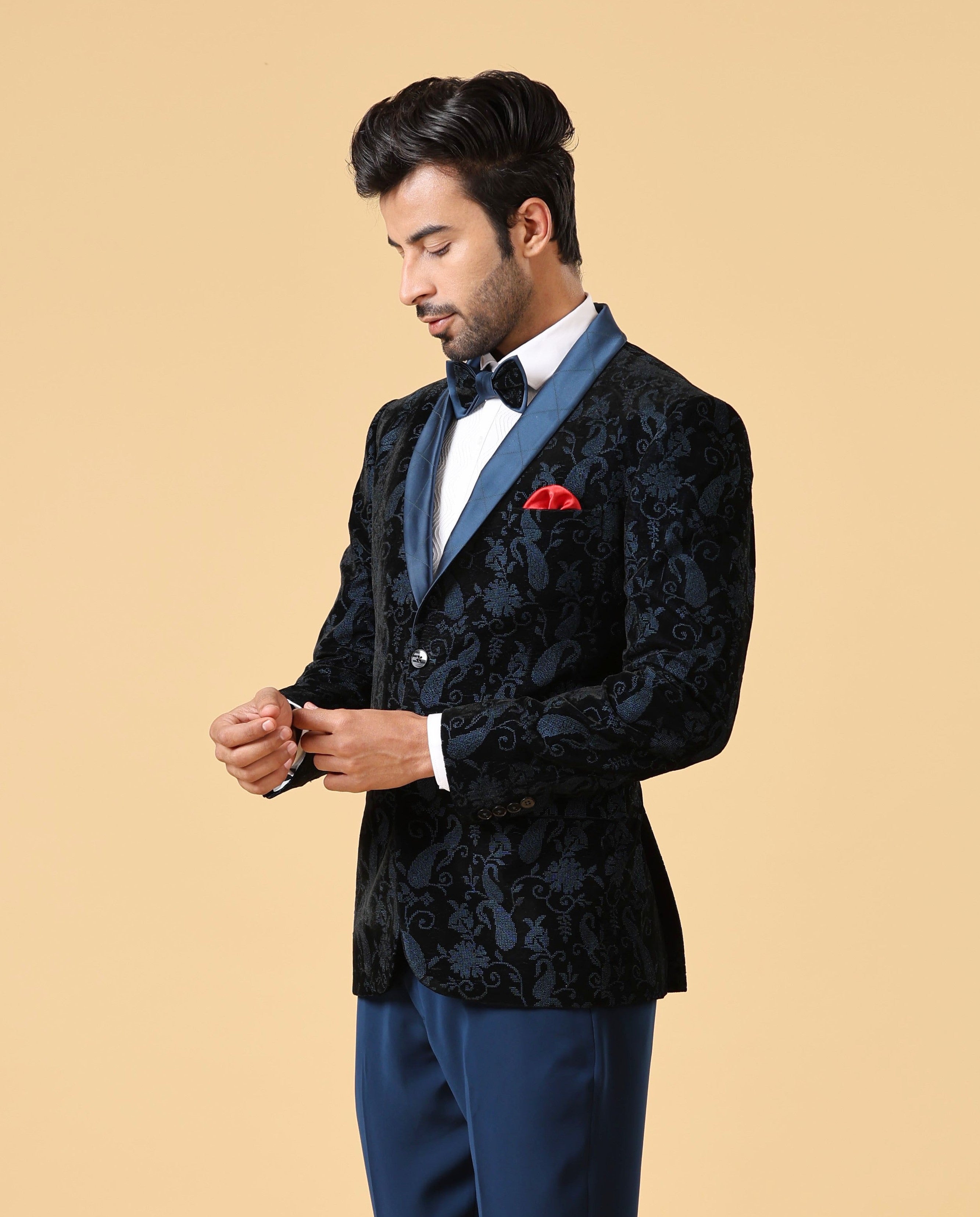 A versatile teal embroidered suit, suitable for various occasions.
