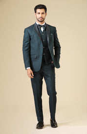 A trendy teal embroidered tuxedo suit, urban style.
