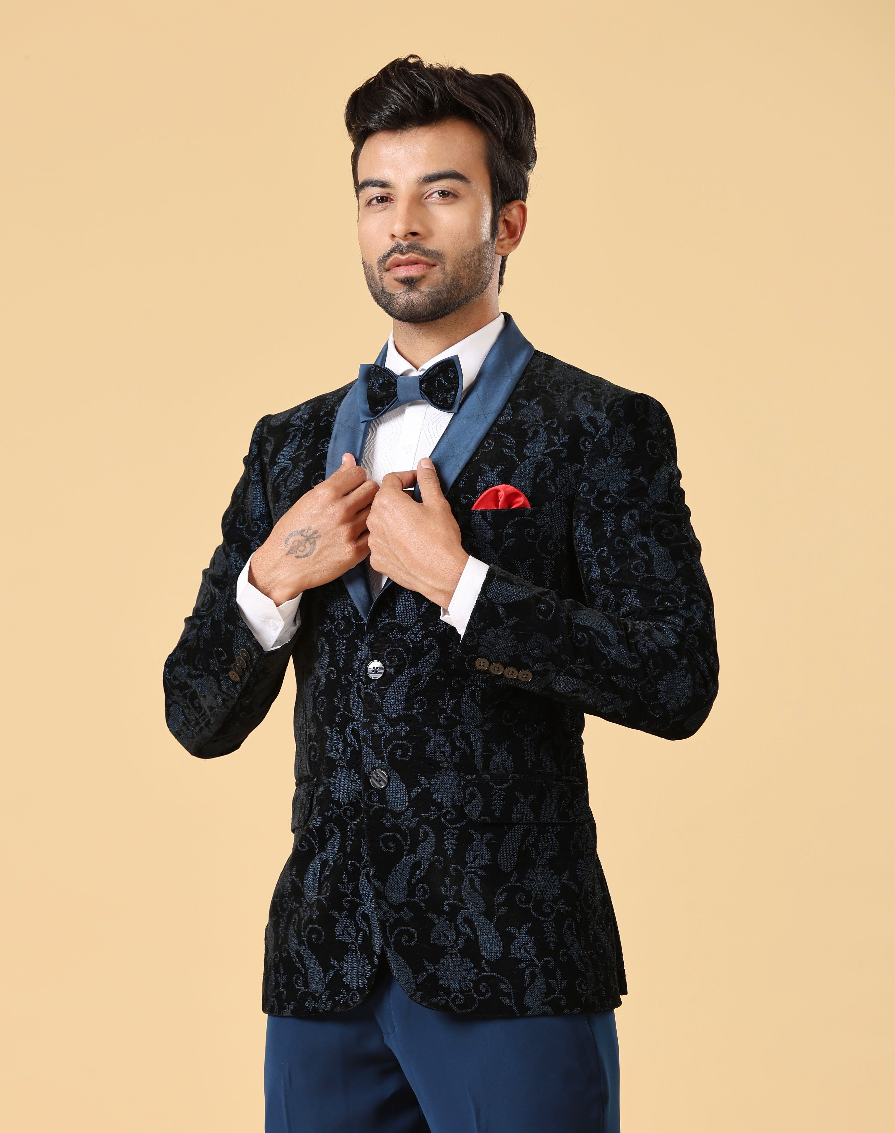 A stylish teal embroidered suit, perfect for weddings and formal occasions.
