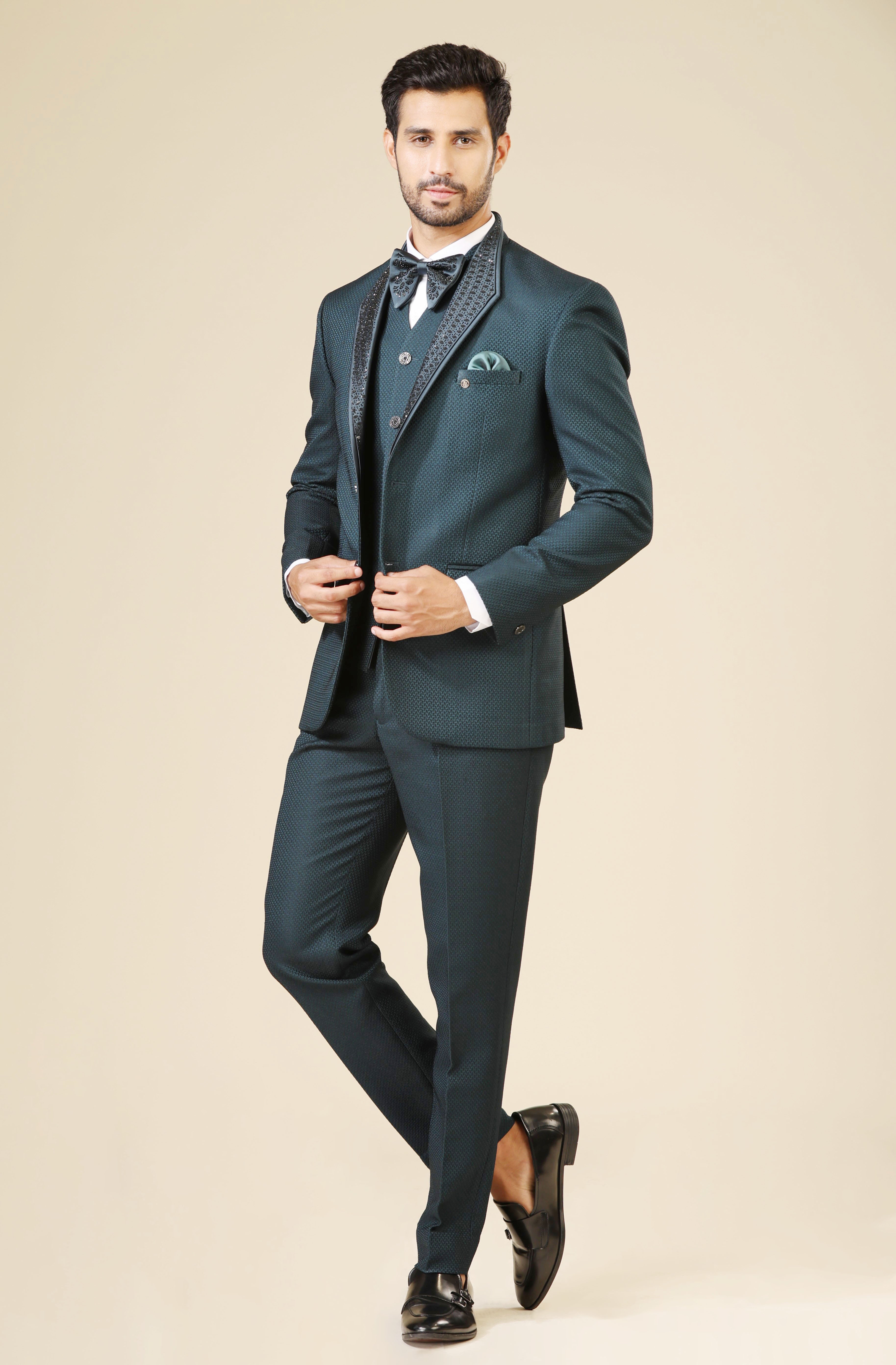 An elegant teal embroidered tuxedo suit, modern men's fashion.
